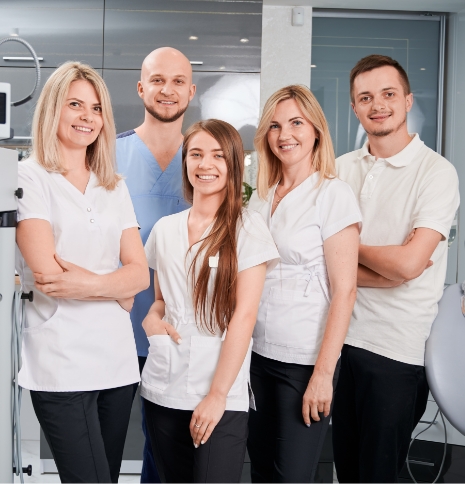 Woman in light brown shirt smiling