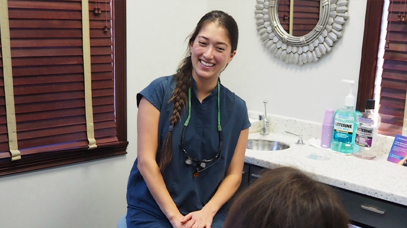 Female dentist in Indianapolis smiling at patient